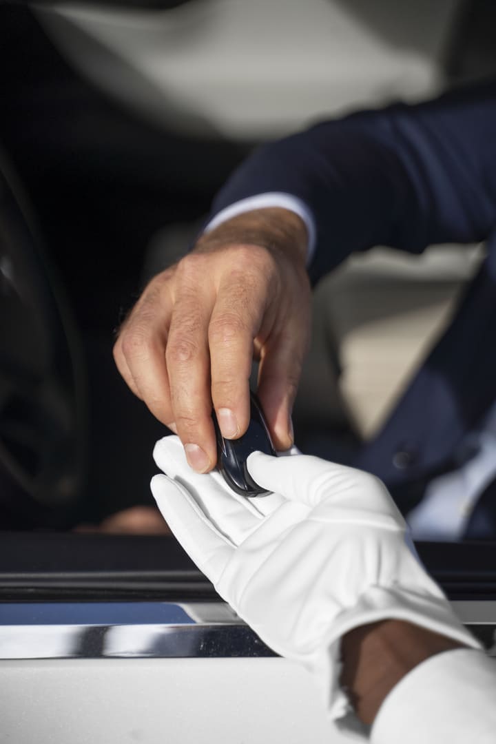 high-angle-hands-holding-key